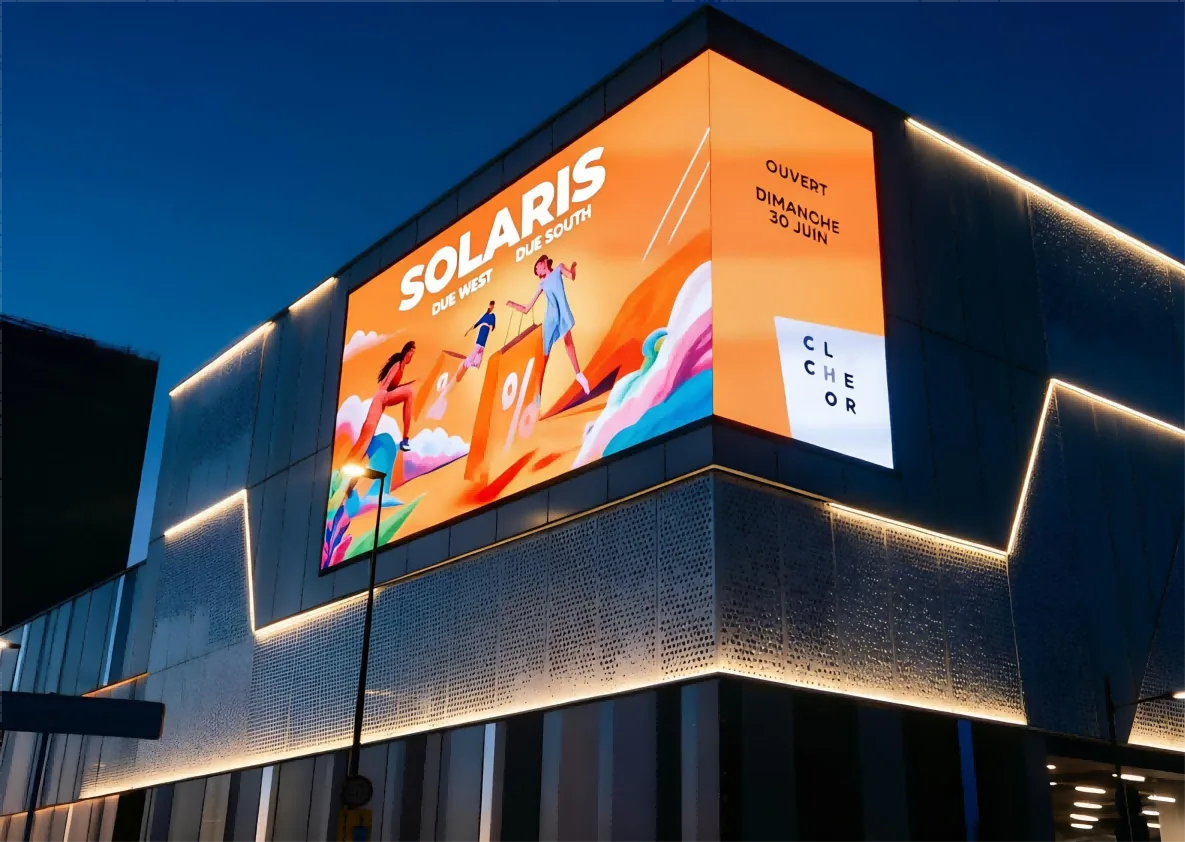 Outdoor LED display installed on building corner with 45-degree bevel cut cabinets