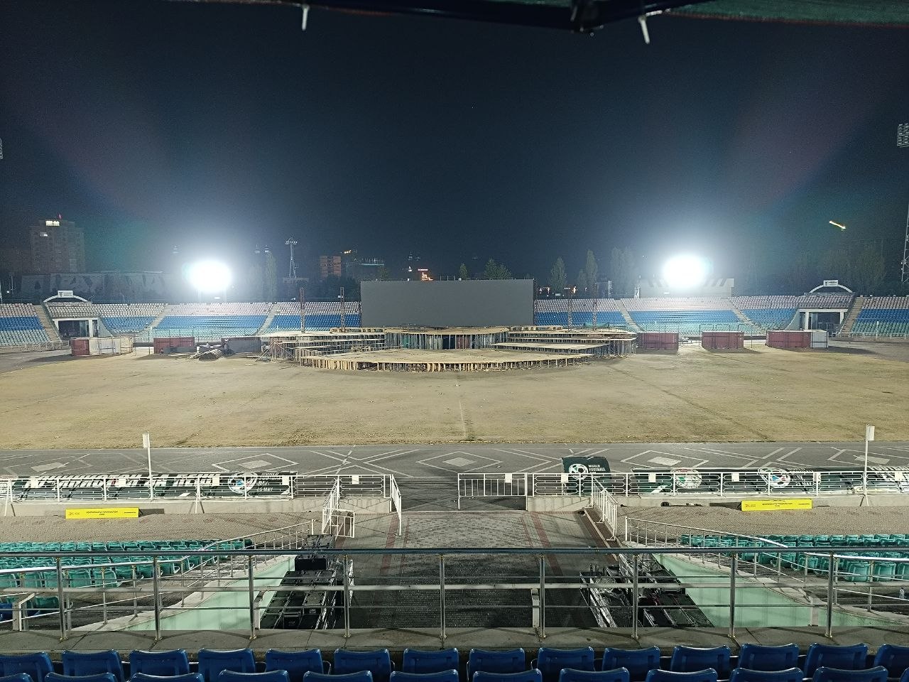 Main outdoor rental LED stage screen under assembly at night for the Tajikistan Independence Day celebration